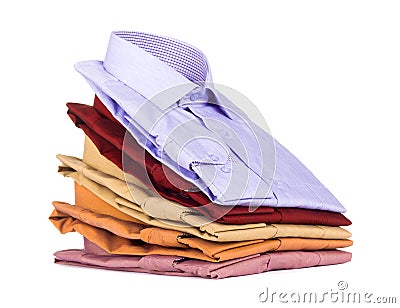 Stacks of many colored clothes Stock Photo