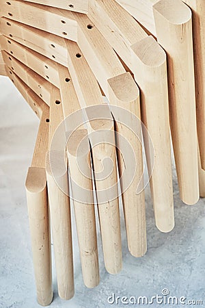 Wooden bases with legs for chairs assembling in paint booth closeup Stock Photo