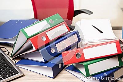 The stacks of office binders on desk Stock Photo