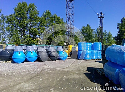 Stacks of septic tanks and other storage tanks at the shipment depot Stock Photo