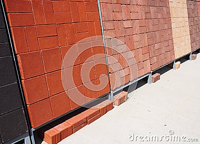Stacks of various and for sale. Building and construction materials, colored concrete pavers (paving stone) Stock Photo