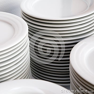 Stacks of white plates Stock Photo