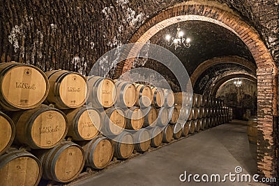 Stacks of wine barrels filled with red wine ageing in the underground tunnels of Ribera del Duero wine region north of Madrid #2 Editorial Stock Photo