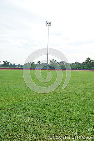 Stadium light inside a stadium with overcast sky with vertical angle Stock Photo