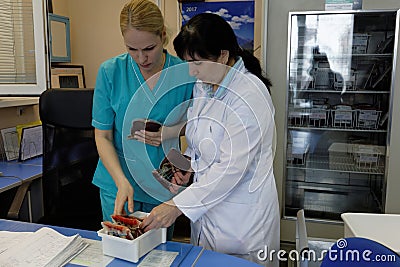 Staff collect the blood in the blood bank Editorial Stock Photo