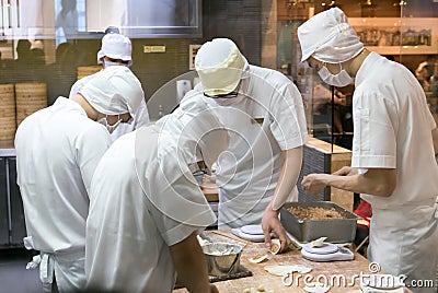 Staff making traditional chinese pork dumpling Editorial Stock Photo