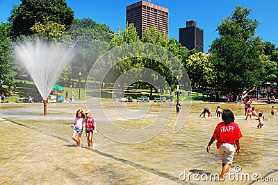 A staff member watches as children Editorial Stock Photo