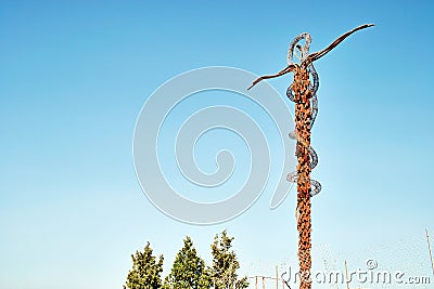 The Staff of Moses also called The Brazen Serpent sculpture by the artist Giovanni Fantoni on the top Editorial Stock Photo