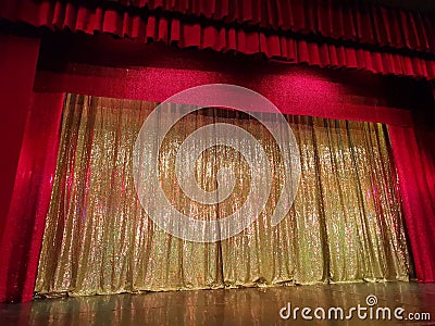 Stage with red curtain - golden shiny in the middle Stock Photo