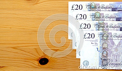 Row of British twenty pound notes on a table Editorial Stock Photo