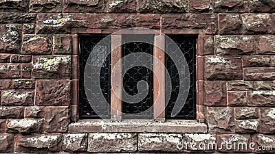Stain Glass Windows Mounted In Classis Stone Wall Stock Photo