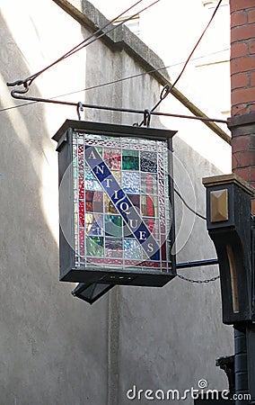 Stained glass antiques shop sign in Dublin, Ireland. Stock Photo