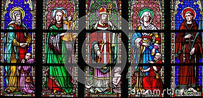 Stained Glass in Brussels Sablon Church - Catholic Saints Stock Photo