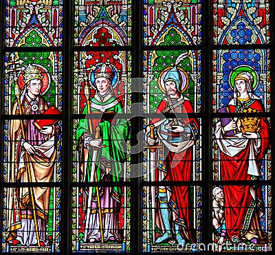 Stained Glass in Brussels Sablon Church - Catholic Saints Stock Photo