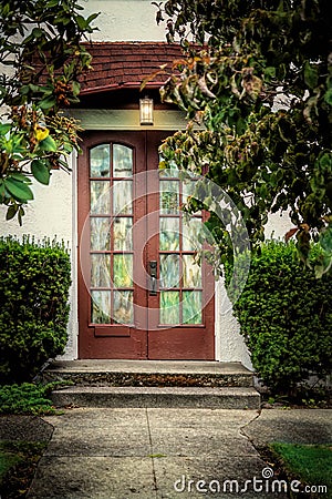 Stained Glass Doorway in Garden Courtyard Stock Photo