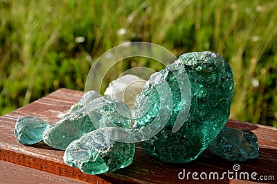 Stained, glass, glasswork, smoothed, rounded, river, collected, children, transparent, wooden, table, brown, turquise, blue, red, Stock Photo