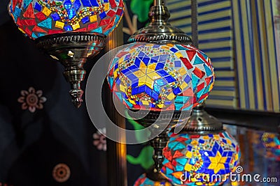 Stained glass hanging lamps for sale at the handicraft market Stock Photo