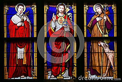 Stained Glass - Jesus Christ, Saint Roch and Saint Charles Borromeo Stock Photo