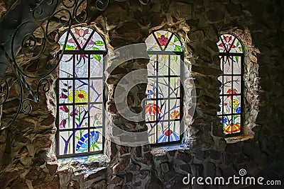 Stained glass Panes at Bishops Castle Rye Colorado Editorial Stock Photo