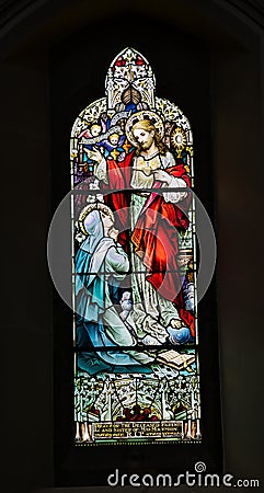 Stained glass windo Depicts prayer for decased parents and Sisters of Mrs Marmion Editorial Stock Photo