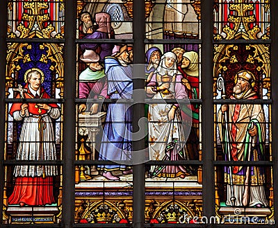 Stained glass window of Catholic Saints in Brussels Cathedral Stock Photo