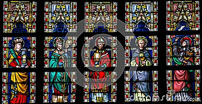 Stained glass window depicting Catholic Saints Stock Photo