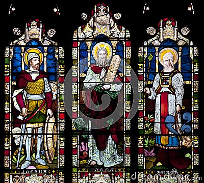 Stained Glass window depicting Joshua, Moses and Haron in Saint Nicholas Church, Arundel, West-Sussex, United Stock Photo