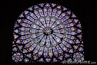 Stained glass window inside Notre Dame de Paris Editorial Stock Photo