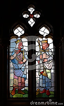 Stained glass window of St John the Baptist Parish Church Editorial Stock Photo