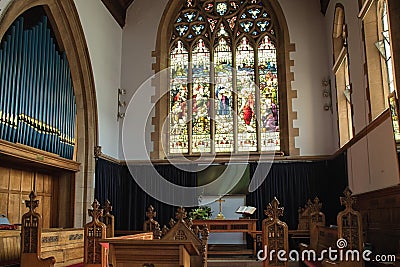 Stained Glass windows and Church Organ. Editorial Stock Photo