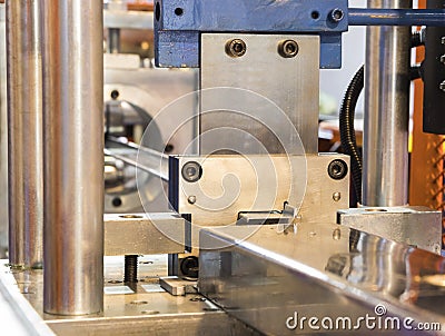 stainless bar sheet exit from die in cold roll process Stock Photo