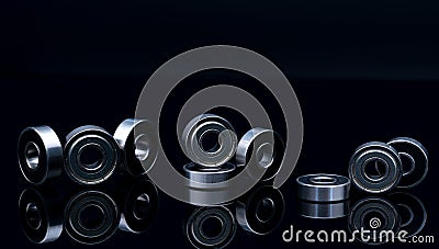 Stainless steel ball bearing on balck backgroud. Set of thrust ball bearing and silver ball bearing. Spare parts for roller Stock Photo