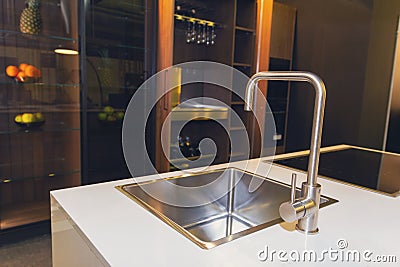 Stainless steel crane and marble countertop Stock Photo