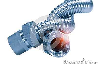 Stainless steel flexible hoses and flexi pipes, fittings and pressure joints close-up mackro. Industrial metal concept Stock Photo