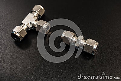 The Stainless steel joint fitting of pneumatic system on black b Stock Photo