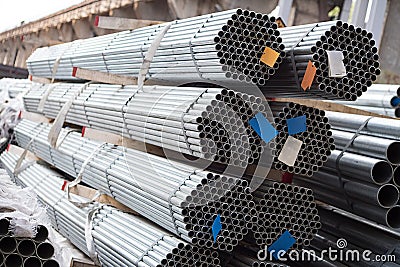 Stainless steel pipes deposited in stacks Stock Photo