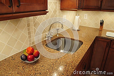 Stainless steel sink in a remodeled kitchen Stock Photo