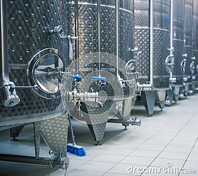 Stainless steel tanks for fermenting grapes. Winery interior Stock Photo
