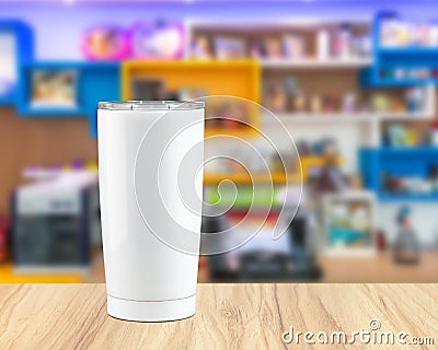 Stainless steel tumbler mug on wooden backdrops. Template of insulated mug for design Stock Photo