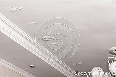 Stains on the ceiling a result of leaking rain water roof. House insurance Stock Photo