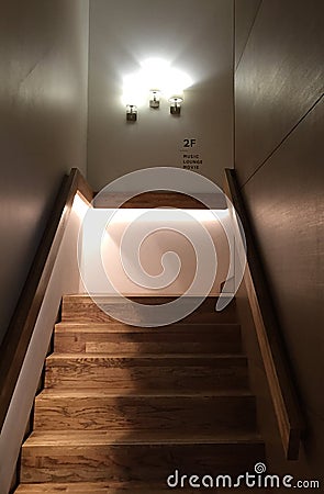 Wooden stair and three of lightings on the wall Stock Photo