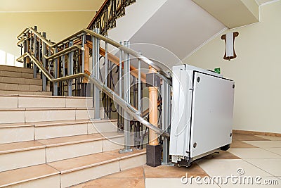 Stair lift for the disabled. Stairs of public building Stock Photo