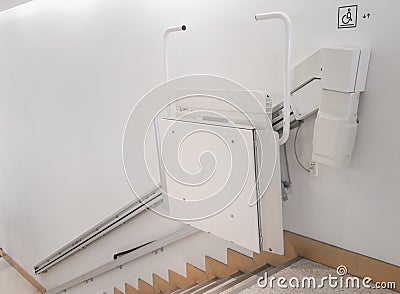 Stairlift on staircase for elderly people in a building Stock Photo