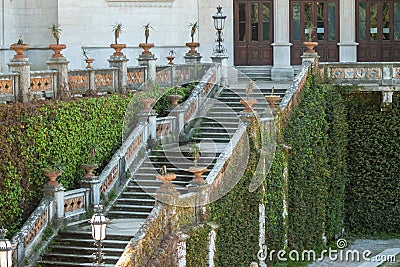 Staircase in castle covered with green leaves Stock Photo