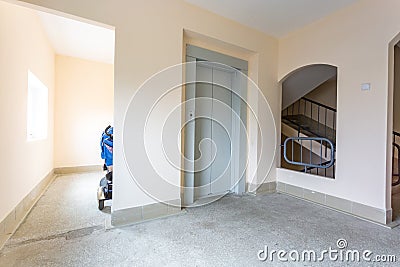 Staircase hall in an apartment building at the entrance to the elevator Stock Photo