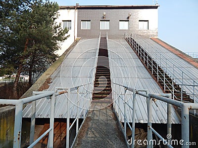 Staircase leading to the building with screw pumps Stock Photo