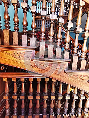 Staircase with polished wood balusters at the Larnach castle in New Zealand Editorial Stock Photo