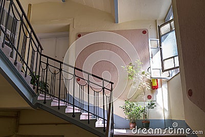 Staircase and stairs to the entrance to the apartment and pot pl Stock Photo