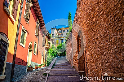 Staircase stairway of narrow street between stone walls Stock Photo