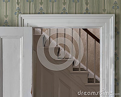 Stairs framed by white wooden doorway Editorial Stock Photo